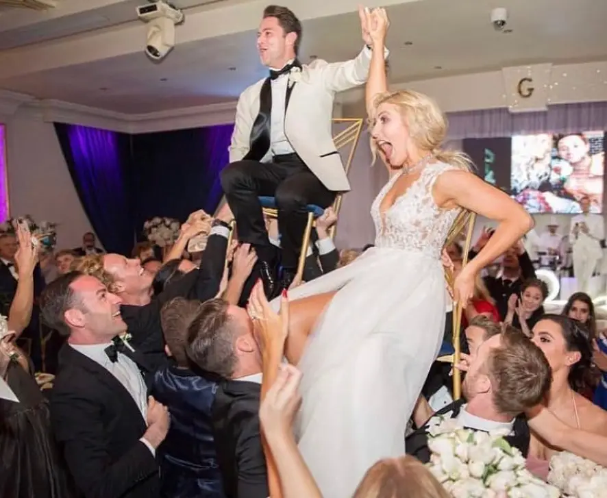 A candid from Emma Slater and Sasha Farber's 2018 wedding.