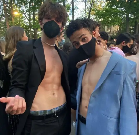 Ked Merwin posing shirtless with his boyfriend