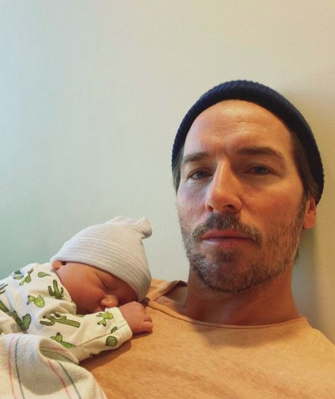 Mark Wystrach and his newborn son. 