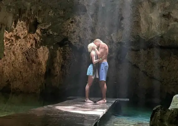 Matt Barr kissing his girlfriend in a cave