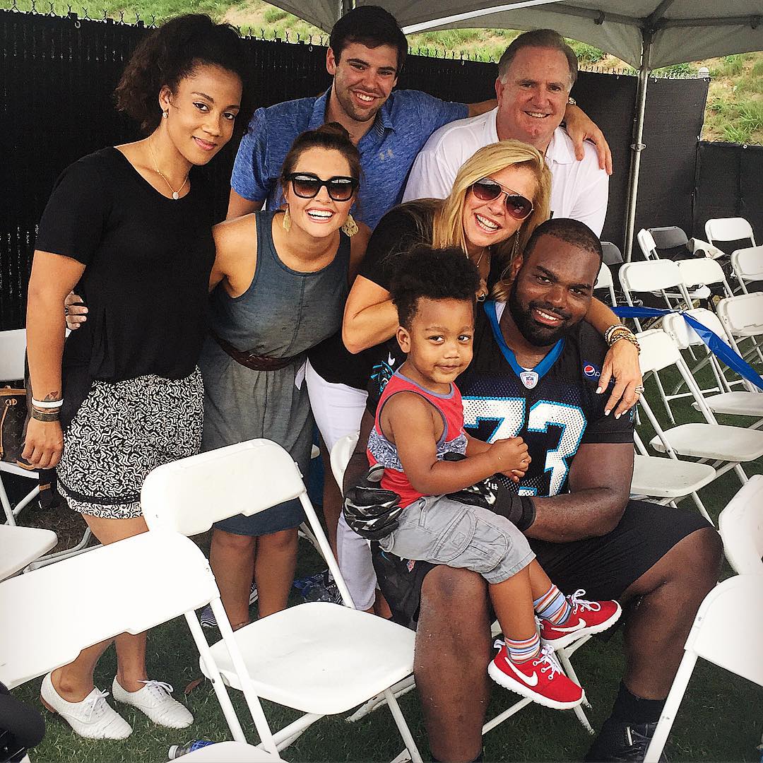 Michael Oher and his wife Tiffany Michelle Roy with the Tuohy family.