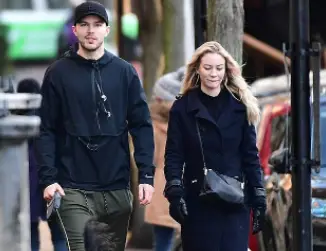 Nicholas Hoult and his girlfriend taking a walk together