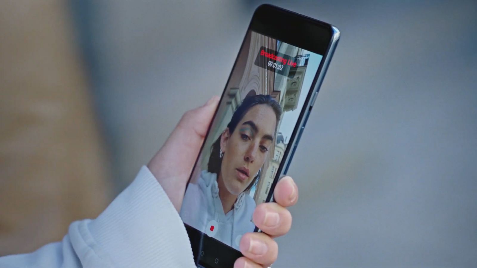 Screenshot of OnePlus Nord promo and glimpse of the phone's front