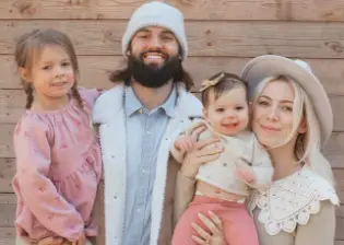 Will Grier with his wife and daughters