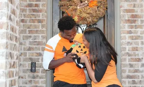 Xavier Woods and his wife, Destiny, celebrating Halloween with their daughter